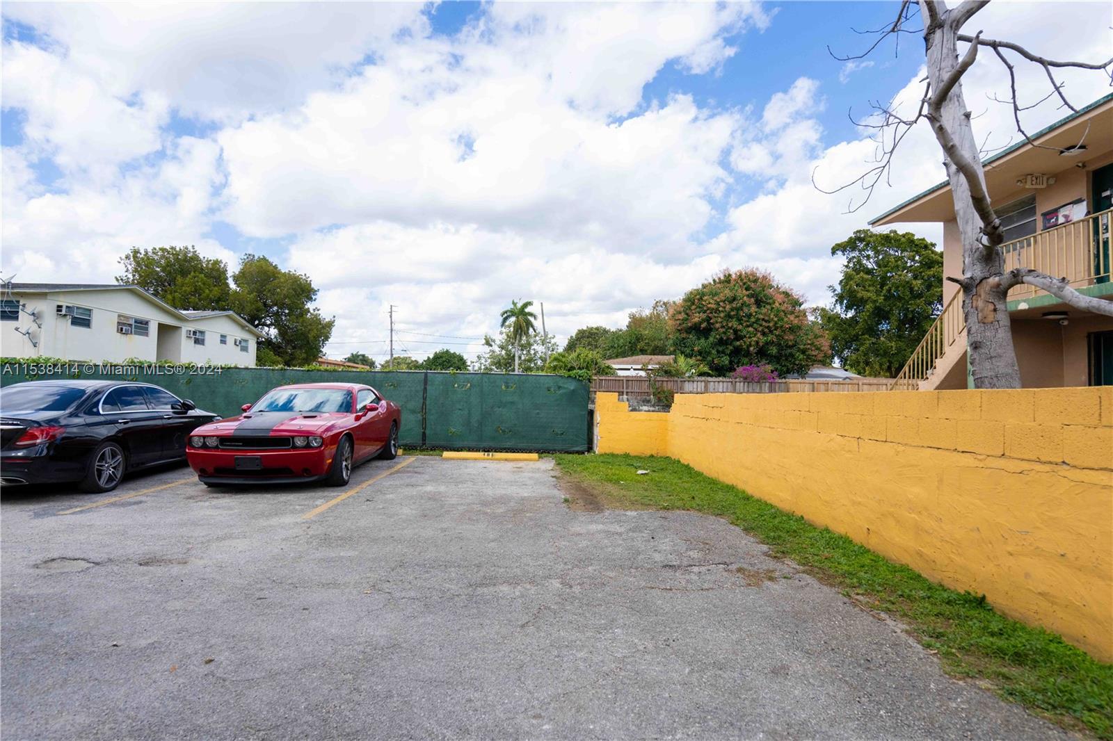 1945 Northwest 29th Street, Unit 8 Miami, FL 33142 - Photo 29 of 31 a view of street with parked cars