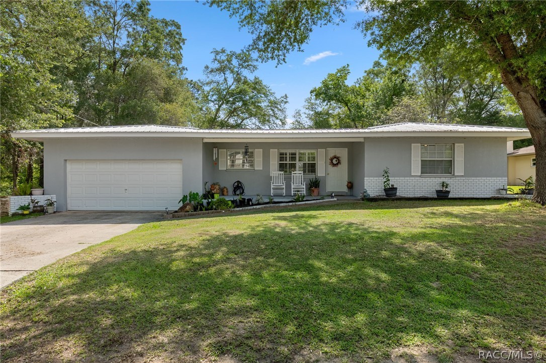 1140 South Highlands Avenue Inverness, FL 34452 - Photo 5 of 54 a view of a house with backyard and sitting area