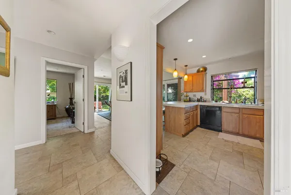 a view of a kitchen with furniture and a window