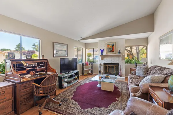 a room with fireplace furniture and a flat screen tv