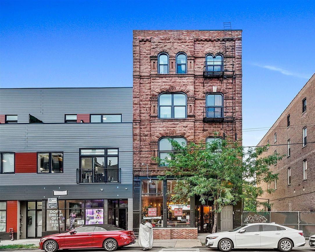 a view of a building with a street