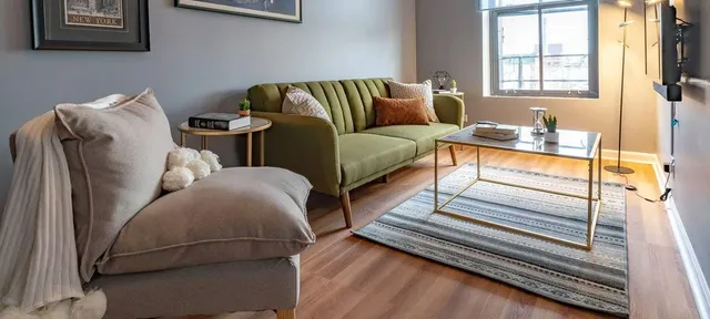 a living room with furniture and a window