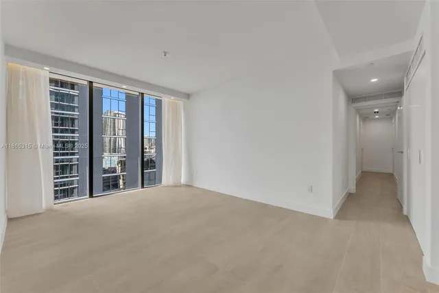 a view of an empty room with a balcony