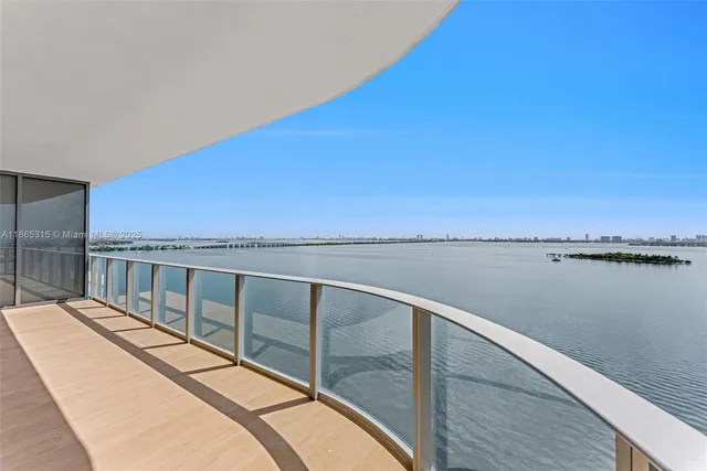 a view of a balcony with lake view and mountain view