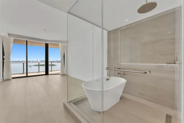 a bathroom with a bathtub and shower