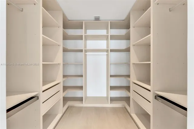 a view of an empty walk in closet