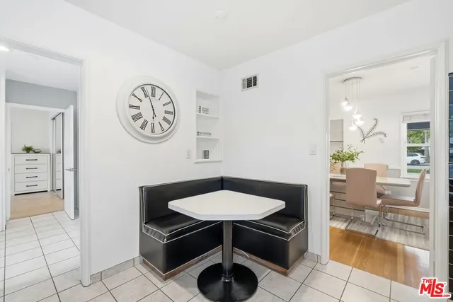 a view of a hallway with seating area