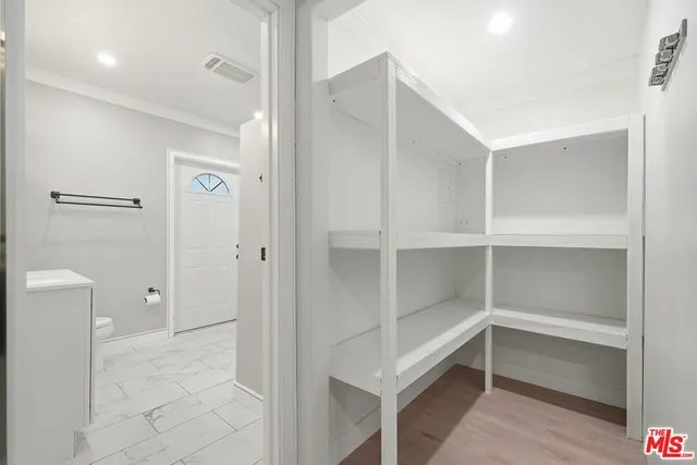 a kitchen with stainless steel appliances granite countertop a sink stove top oven and cabinets