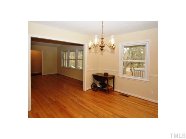 4801 Will-O-Dean Road Raleigh, NC 27616 - Photo 5 of 23 a living room with furniture and a chandelier