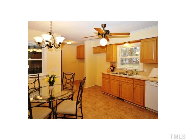 4801 Will-O-Dean Road Raleigh, NC 27616 - Photo 6 of 23 a kitchen with a table and chairs