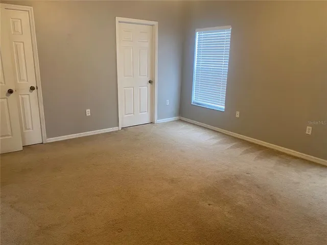 an empty room with windows