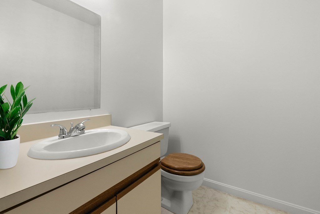 36 Dunham Road, Unit 306 Beverly, MA 01915 - Photo 18 of 26 a bathroom with a sink and a mirror