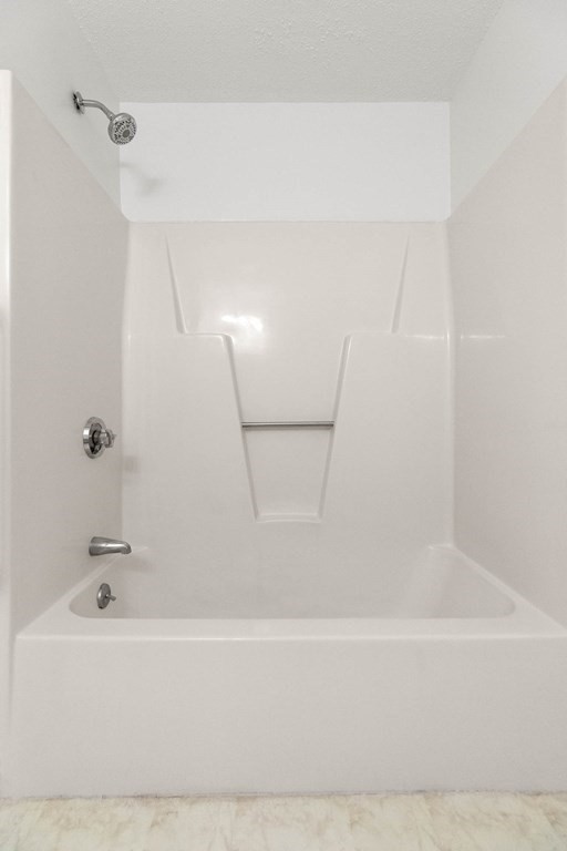 36 Dunham Road, Unit 306 Beverly, MA 01915 - Photo 20 of 26 a bathroom with a bathtub and a shower