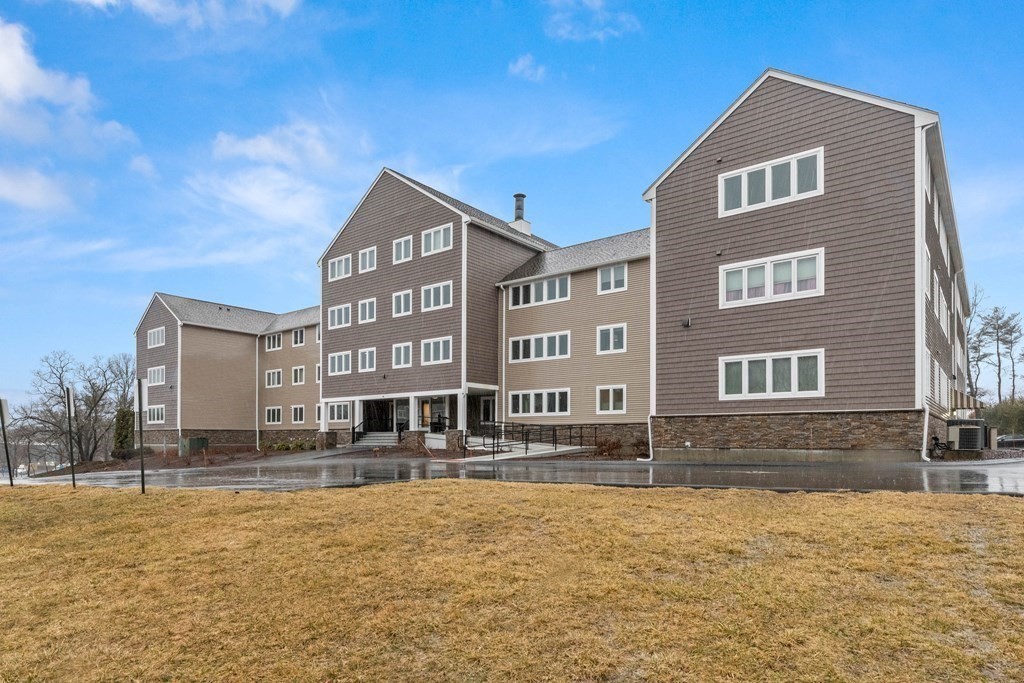 36 Dunham Road, Unit 306 Beverly, MA 01915 - Photo 2 of 26 a front view of a building