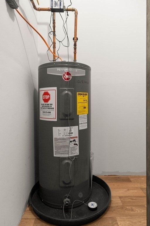 36 Dunham Road, Unit 306 Beverly, MA 01915 - Photo 21 of 26 a view of a storage room with a table and chairs