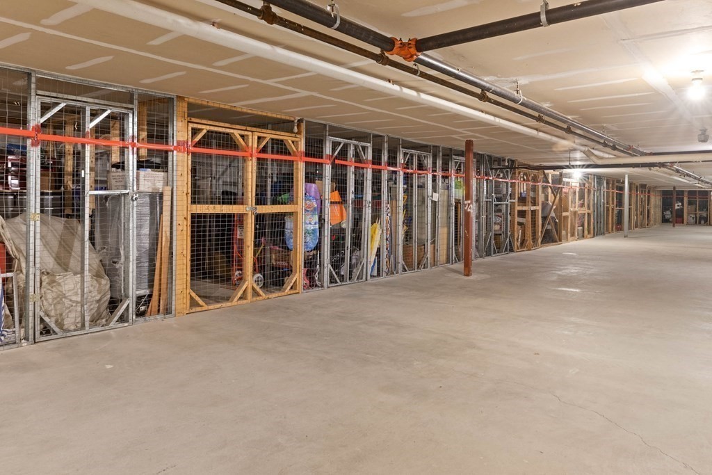 36 Dunham Road, Unit 306 Beverly, MA 01915 - Photo 23 of 26 a view of an empty room with wooden walls