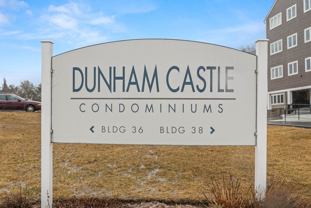 36 Dunham Road, Unit 306 Beverly, MA 01915 - Photo 4 of 26 a sign on the side of a building