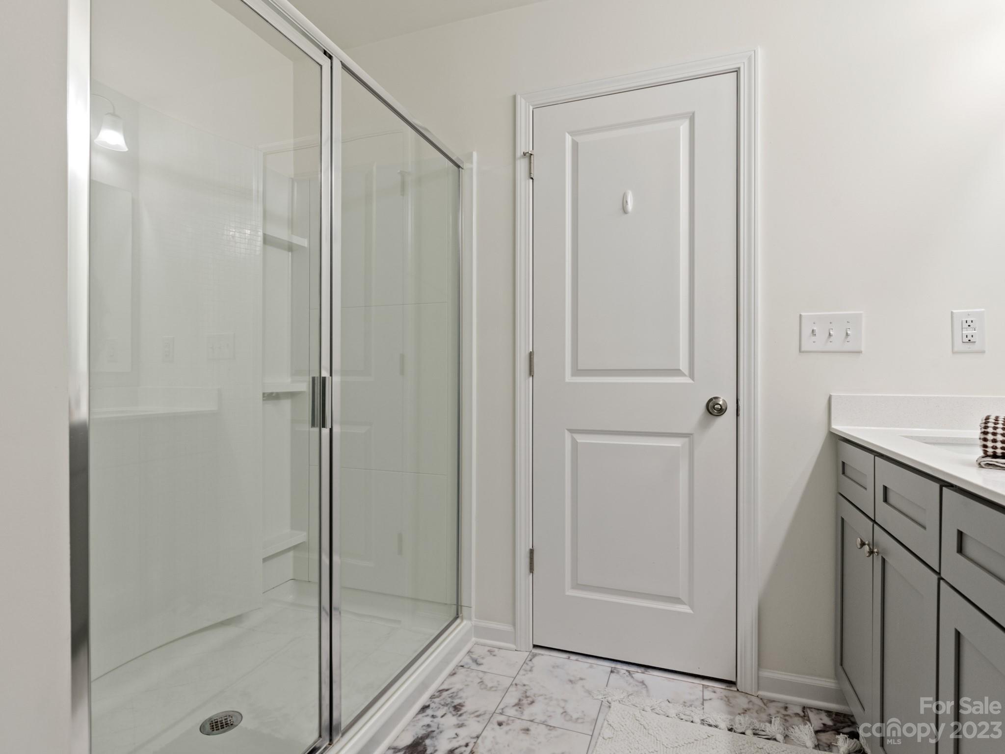 225 Quinn Road Matthews, NC 28104 - Photo 17 of 24 a bathroom with a shower and a sink