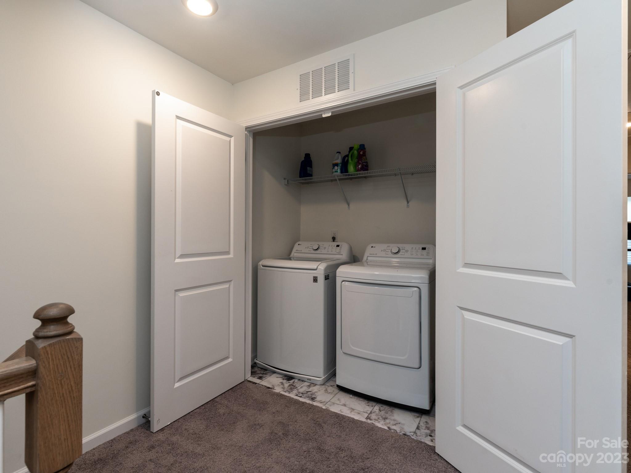 225 Quinn Road Matthews, NC 28104 - Photo 21 of 24 a view of storage and utility room with washer and dryer