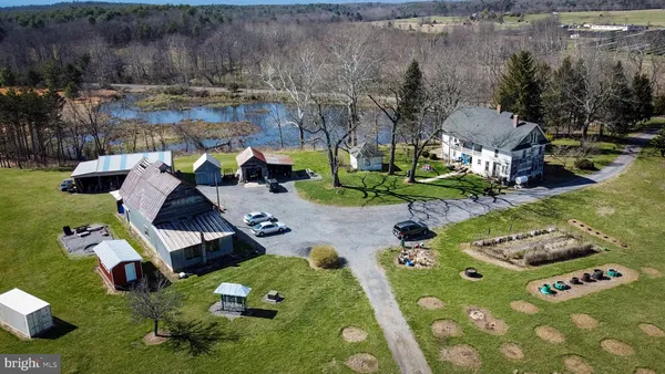 an aerial view of a house with garden space and street view