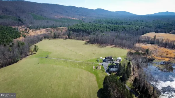 a view of a swimming pool with a yard