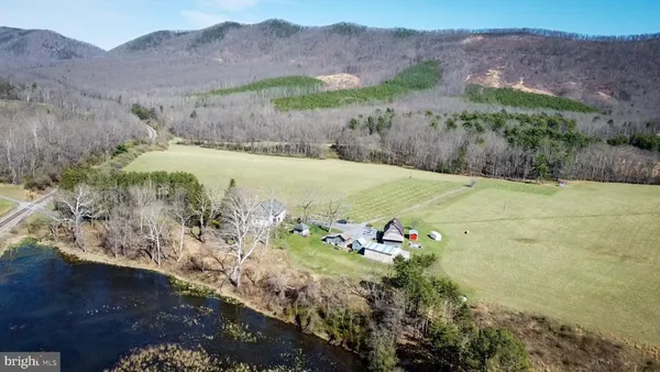 a view of a mountain with a yard