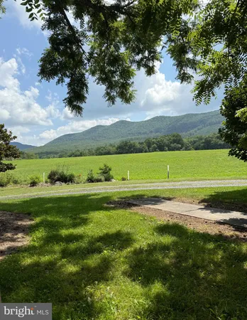 a view of a golf course with a big yard