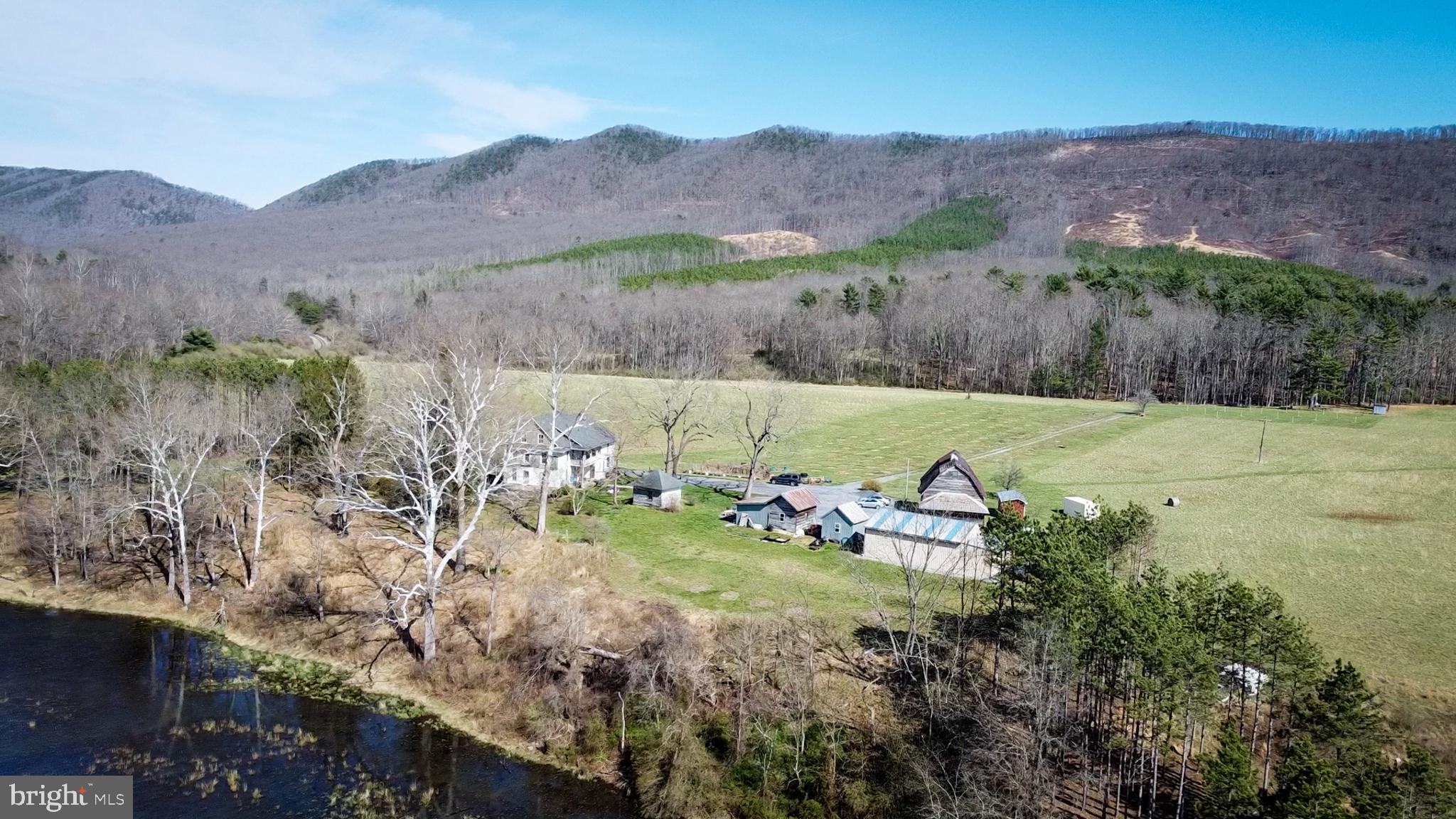 33940 Mountain Valley Road Millboro, VA 24460 - Photo 10 of 22 Serene countryside retreat with mountains.