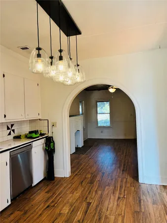 a kitchen with sink and cabinets