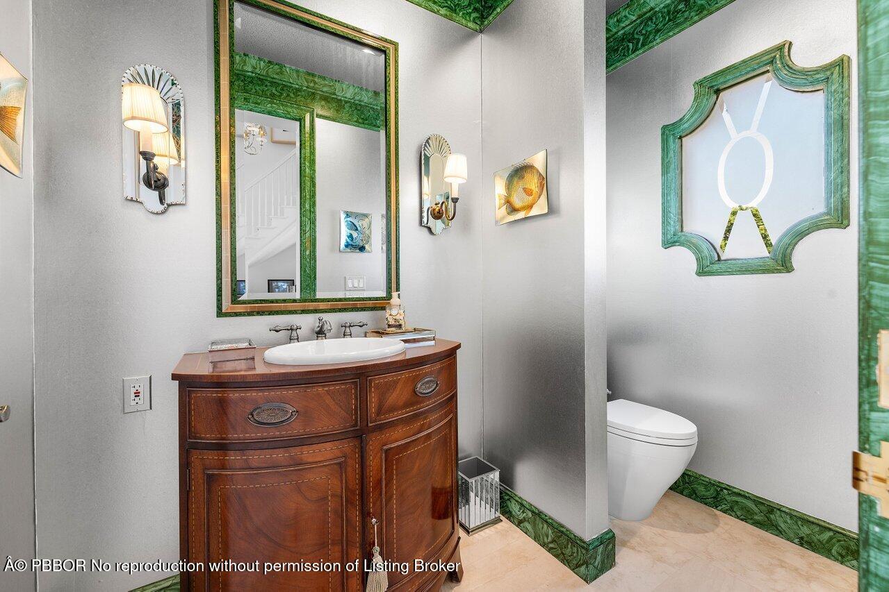 1275 Lands End Road Lake Worth, FL 33462 - Photo 11 of 83 a bathroom with a granite countertop toilet sink and mirror