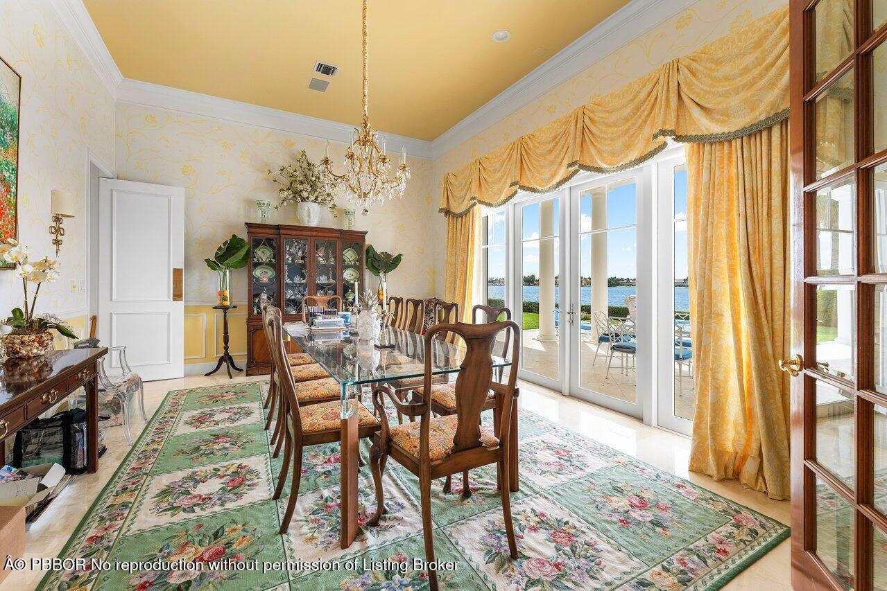 1275 Lands End Road Lake Worth, FL 33462 - Photo 13 of 83 a view of a dining room with furniture window and wooden floor