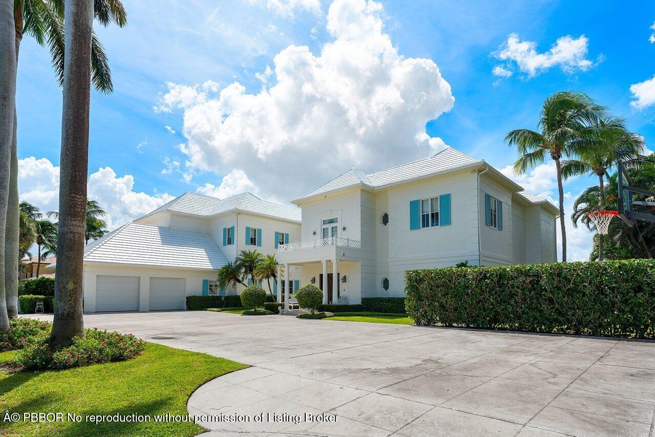 1275 Lands End Road Lake Worth, FL 33462 - Photo 2 of 83 a view of a house with a yard and a garage