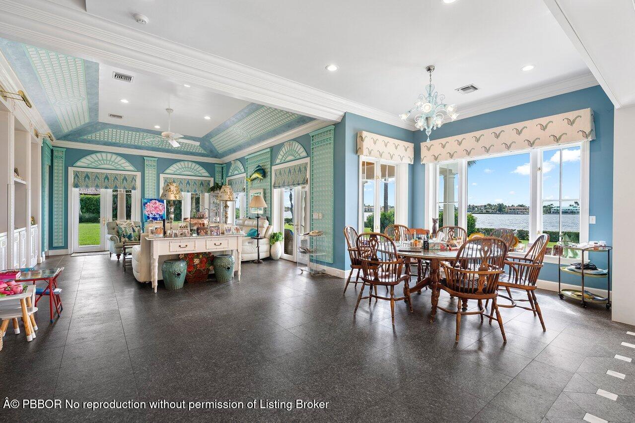 1275 Lands End Road Lake Worth, FL 33462 - Photo 21 of 83 a dining room with furniture window and wooden floor