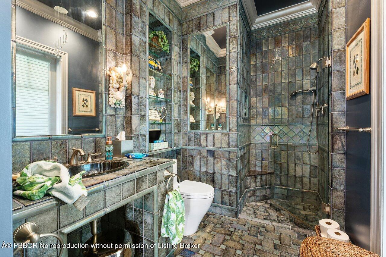 1275 Lands End Road Lake Worth, FL 33462 - Photo 24 of 83 a bathroom with a sink a toilet and shower