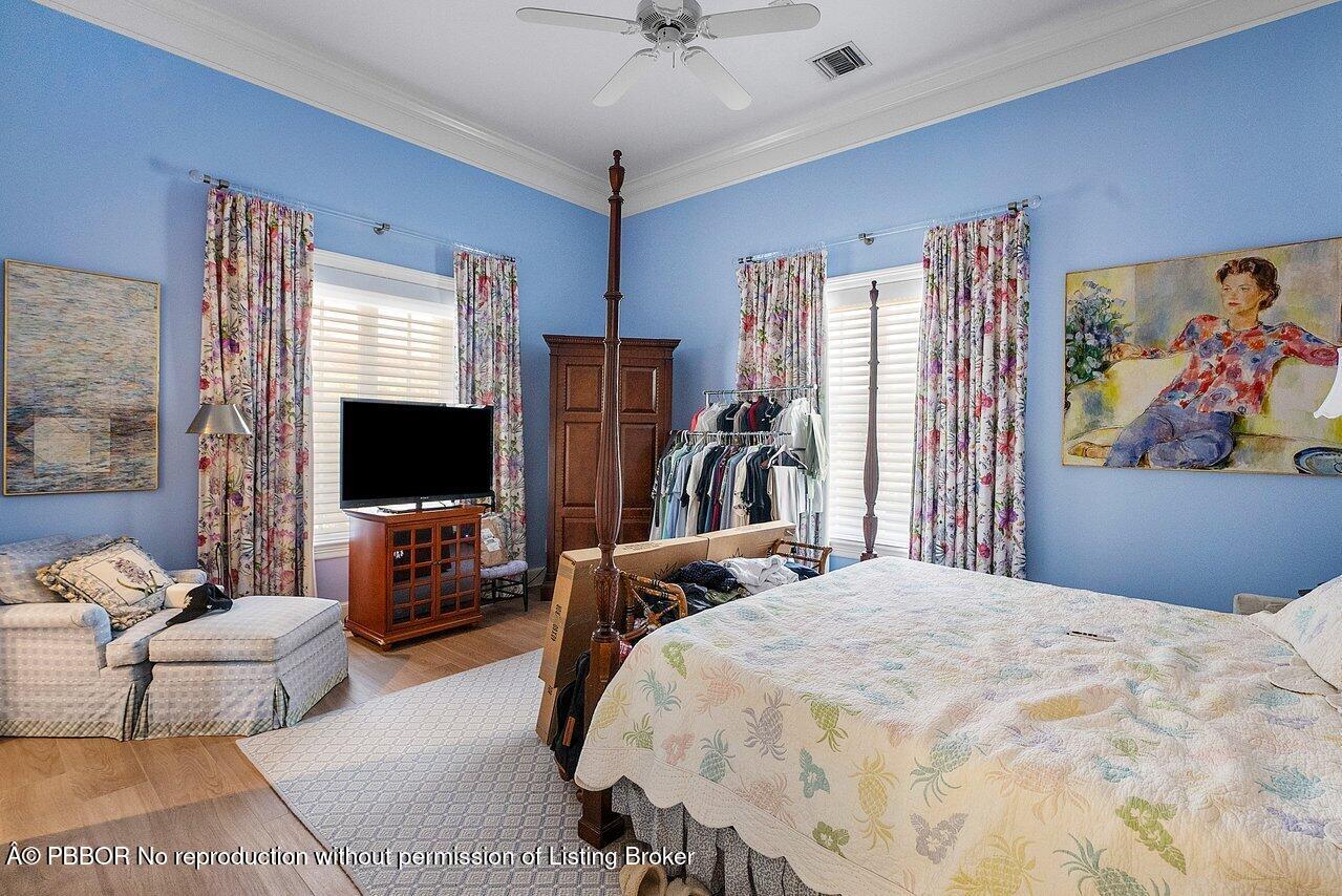 1275 Lands End Road Lake Worth, FL 33462 - Photo 32 of 83 a bedroom with a bed and a flat screen tv
