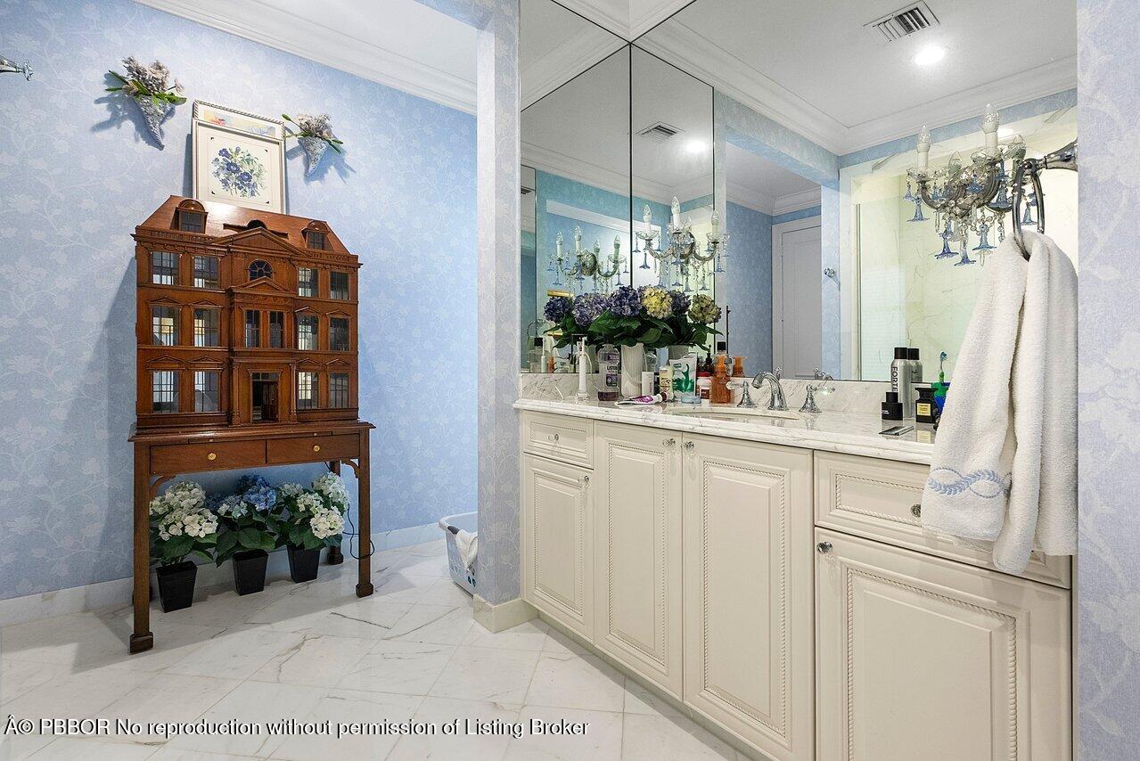 1275 Lands End Road Lake Worth, FL 33462 - Photo 34 of 83 a bathroom with a sink and a mirror