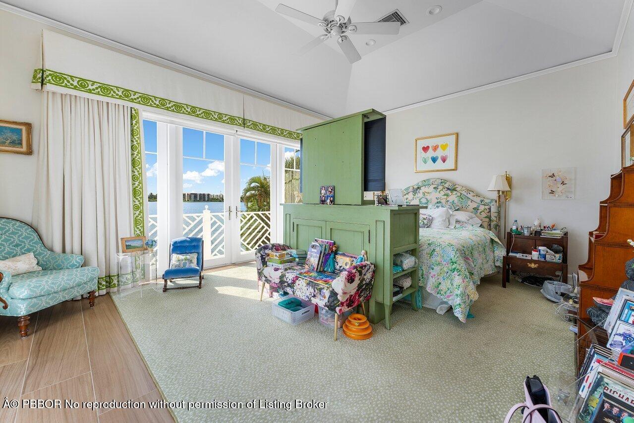 1275 Lands End Road Lake Worth, FL 33462 - Photo 41 of 83 a bedroom with furniture and a large window