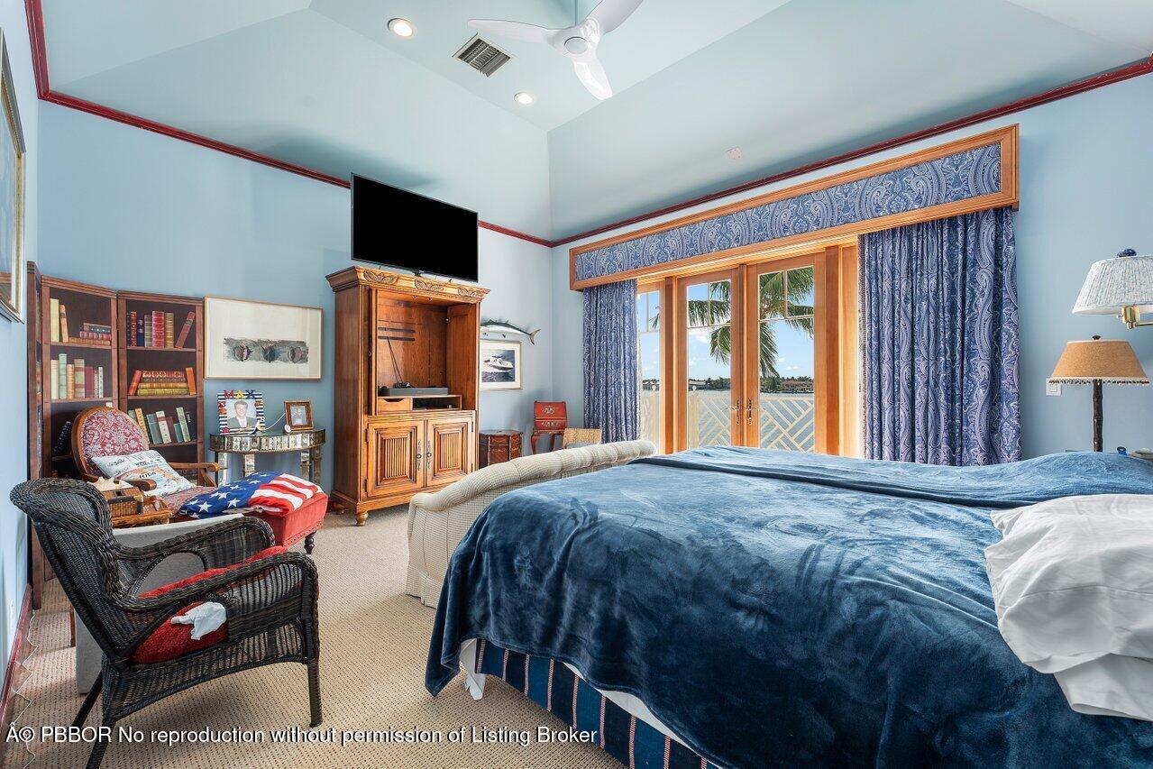 1275 Lands End Road Lake Worth, FL 33462 - Photo 45 of 83 a bedroom with a bed furniture and a large window