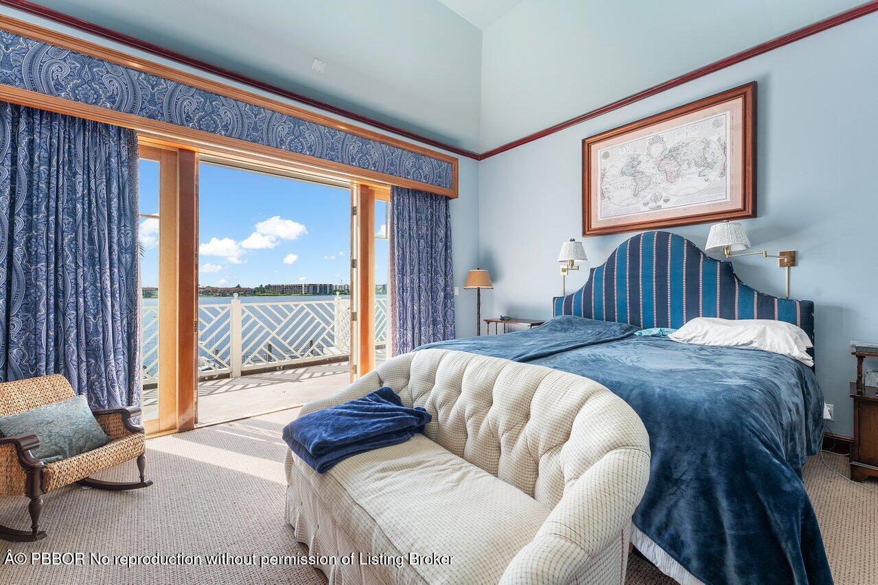 1275 Lands End Road Lake Worth, FL 33462 - Photo 46 of 83 a bedroom with furniture and a large window