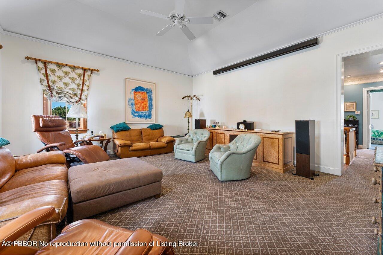 1275 Lands End Road Lake Worth, FL 33462 - Photo 50 of 83 a living room with furniture and a chandelier