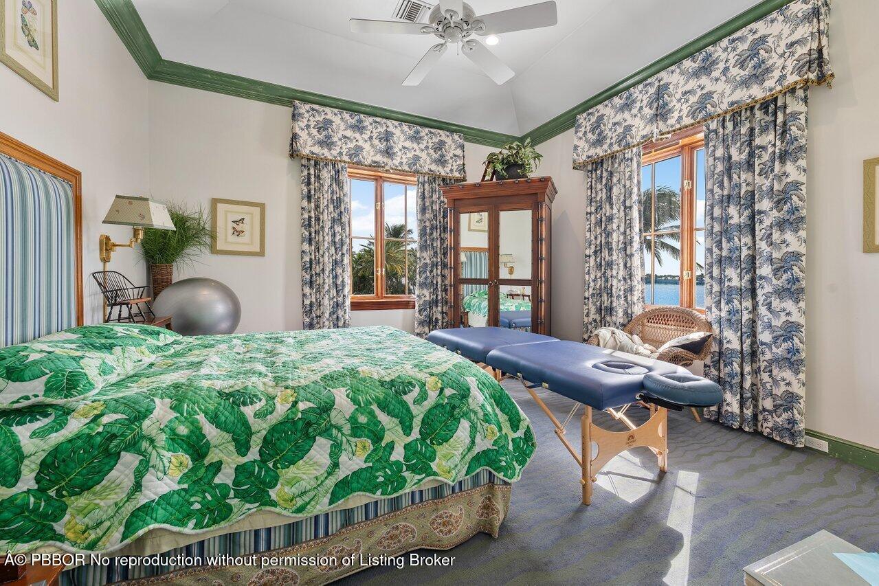 1275 Lands End Road Lake Worth, FL 33462 - Photo 54 of 83 a bedroom with a bed and window