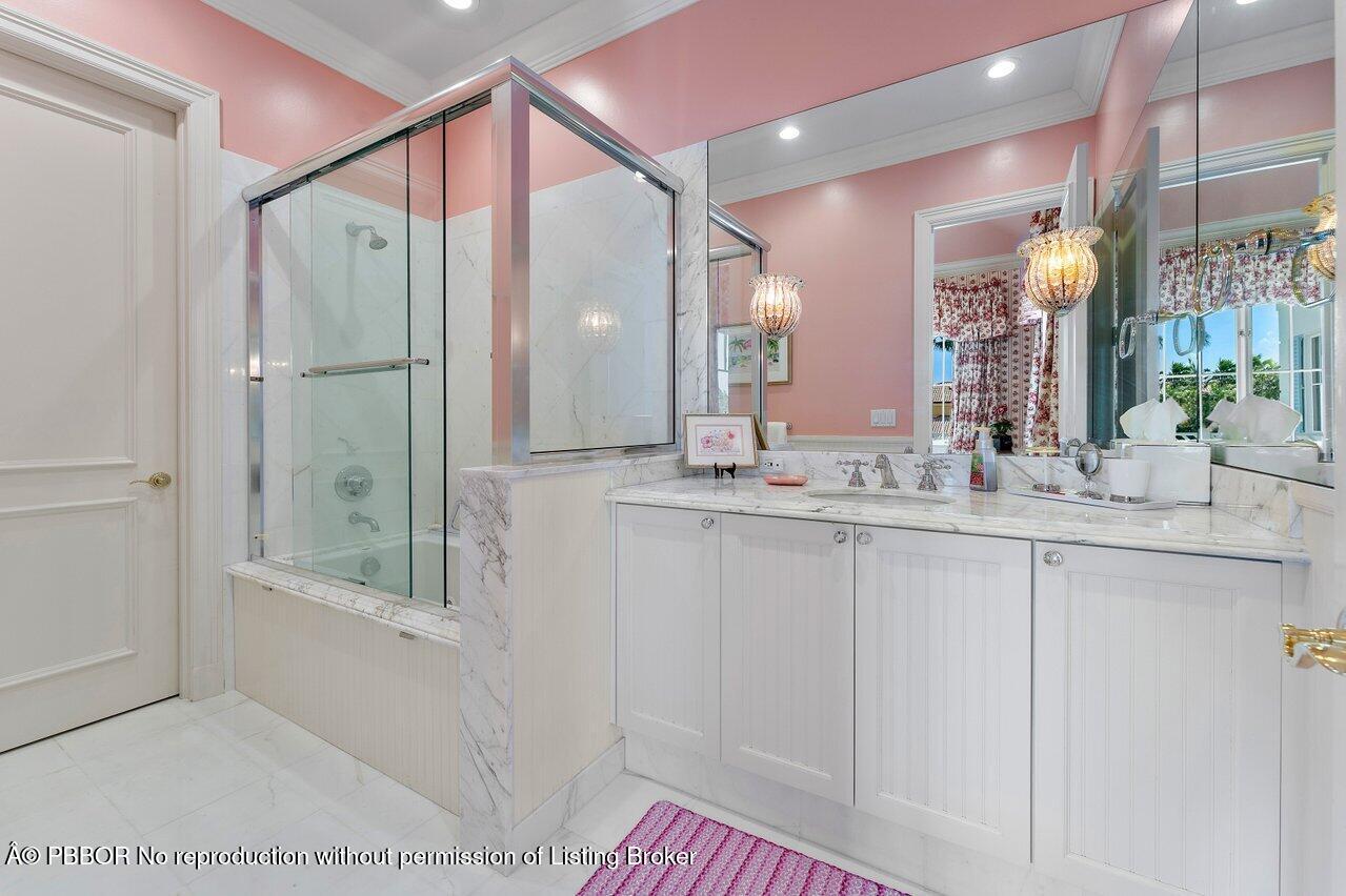 1275 Lands End Road Lake Worth, FL 33462 - Photo 58 of 83 a bathroom with a shower sink and mirror