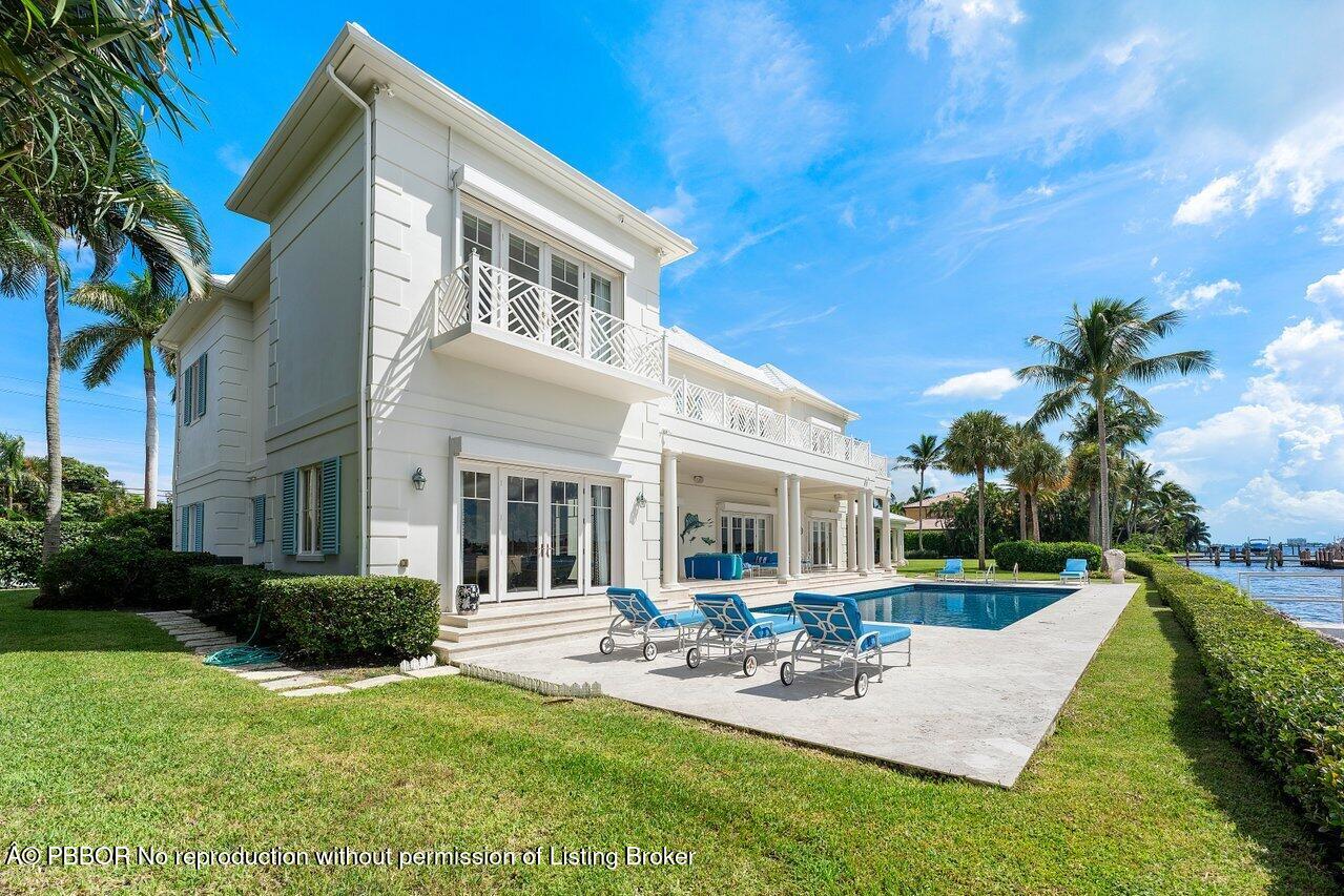 1275 Lands End Road Lake Worth, FL 33462 - Photo 64 of 83 a view of a house with backyard and sitting area