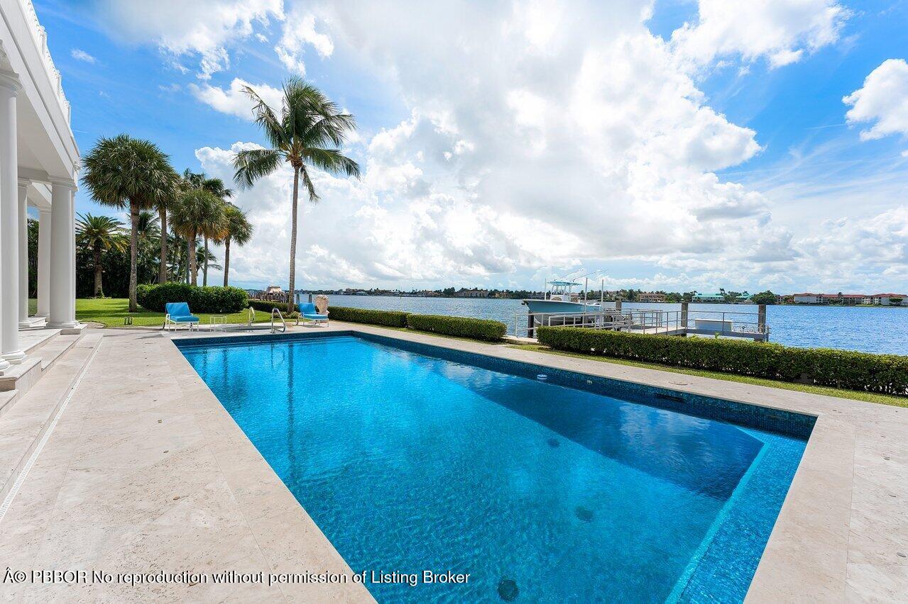 1275 Lands End Road Lake Worth, FL 33462 - Photo 67 of 83 a view of swimming pool with seating area and barbeque oven
