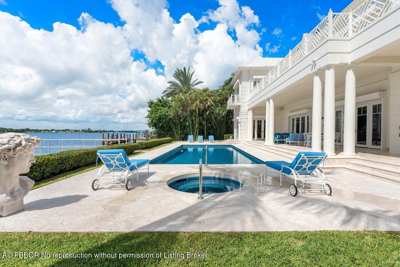 1275 Lands End Road Lake Worth, FL 33462 - Photo 68 of 83 a view of a house with swimming pool and sitting area
