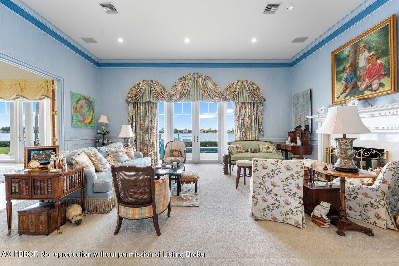 1275 Lands End Road Lake Worth, FL 33462 - Photo 7 of 83 a living room with furniture a fireplace and a large window