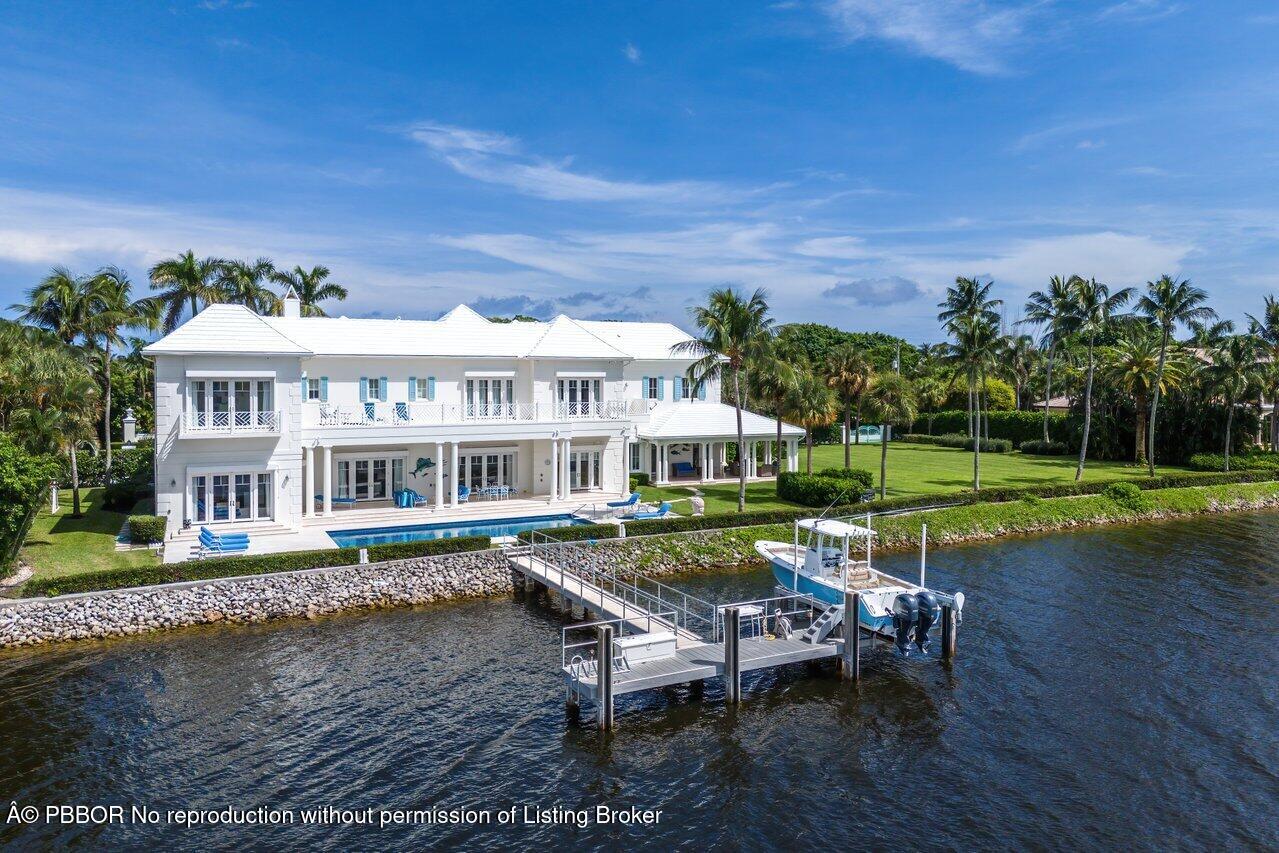 1275 Lands End Road Lake Worth, FL 33462 - Photo 71 of 83 a view of a house with backyard porch and sitting area