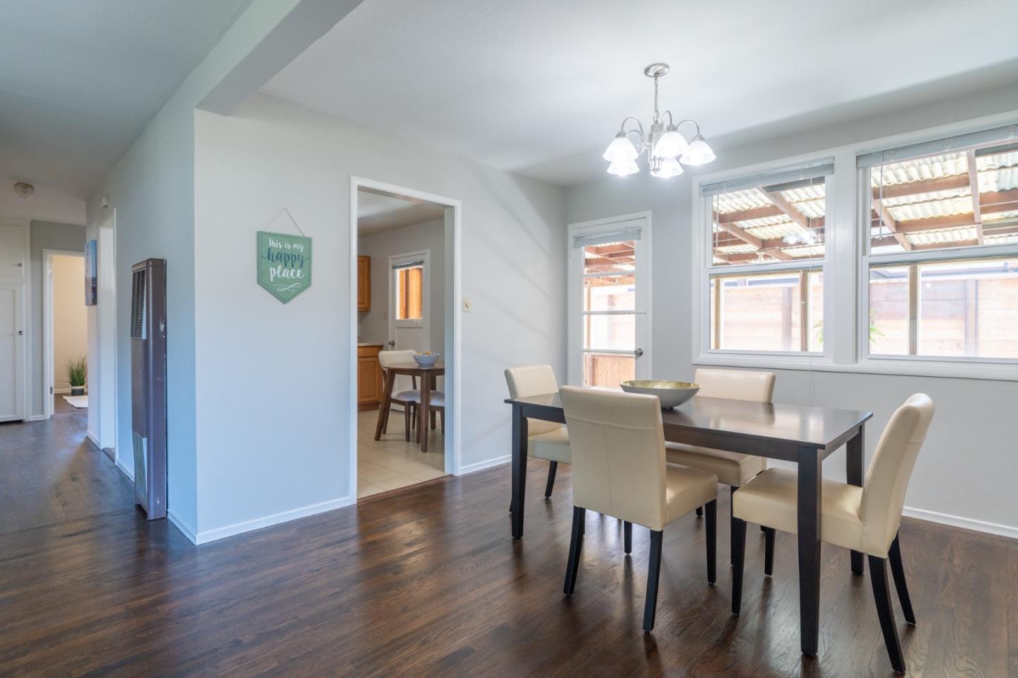1063 Anza Drive Pacifica, CA 94044 - Photo 8 of 10 a view of a dining room with furniture window and wooden floor