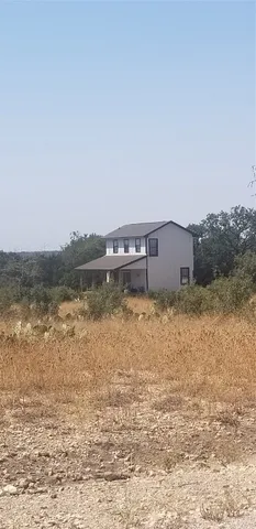 a view of yard with large tree