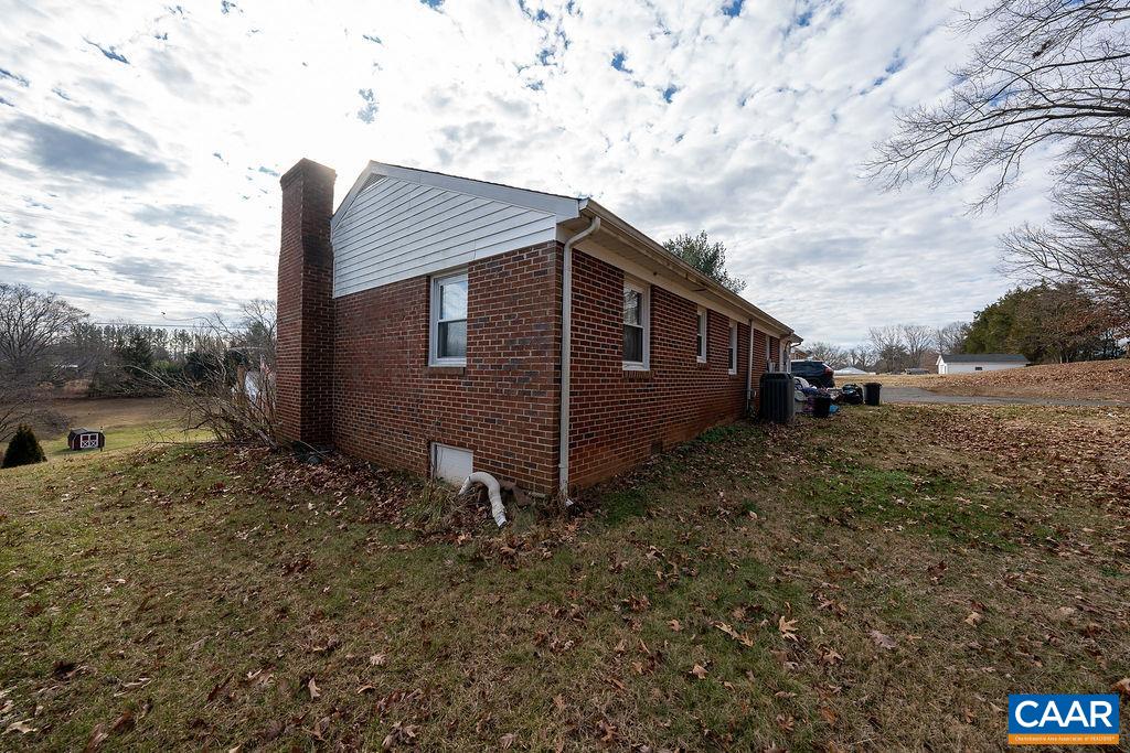 471 Locust Lane Ruckersville, VA 22968 - Photo 30 of 57 a view of a wooden house with a yard